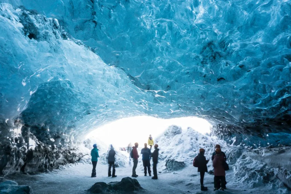 Inside an ice cave in Iceland. The Ultimate Guide to Ice Caves in Iceland: Everything you ever needed to know about visiting ice caves in Iceland. Find out how to go INSIDE the Crystal Cave glacier ice cave to see the blue ice.