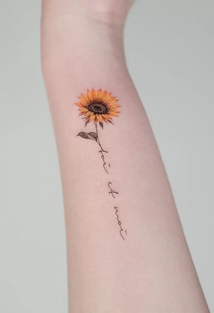 Tattoo uploaded by Stacie Mayer  A simple font offset by some pretty  sunflowers Tattoo by Leah Greenwood sunflower flower quote  newotraditional LeahGreenwood  Tattoodo